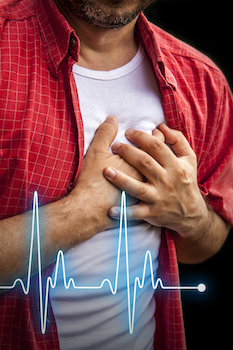 Man clutching hands over heart