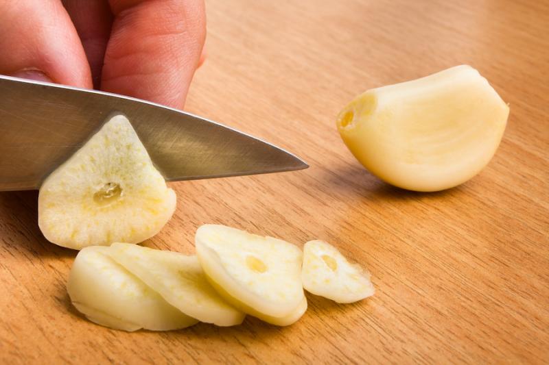 Fresh garlic slices from Adobe Stock